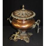 19th Century copper samovar, with a lidded top above a body flanked by hands and a tap to the
