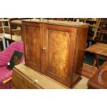 19th Century mahogany wall mounted cupboard, the rectangular cupboard with a pair of doors enclosing