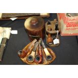 Collection of pipes, with stands and a tobacco box