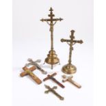 Collection of Corpus Christie's, to include two brass examples and five wall hanging examples, (7)