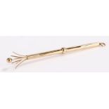 9 carat gold swizzle stick, assayed Birmingham, the slender stock with a sliding collar revealing