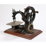 Willcox & Gibbs sewing machine, the ebonised body with engraved steel sewing surface, on a