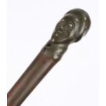 19th Century walking cane, the horn carved handle in the form of a male head above the tapering