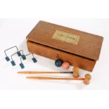 Table croquet set, with mallets, hoops, balls etc. housed in a wooden box
