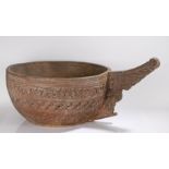 Exceedingly large carved Indian bowl, the deep and wide bowl with a carved outer in bands of scrolls