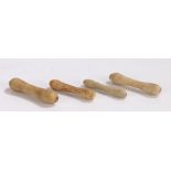 Collection of four 18th Century clay wig curlers, of typical form, 53mm to 63mm long, (4)