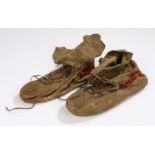 Pair of 19th Century Native American hide Moccasins, with delicate foliate design and red fabric