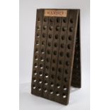 Wooden easel wine rack, with recesses for 120 bottles, bearing labels for "Champagne Gardet Chigny-