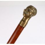 Brass and malacca walking stick, surmounted with a bust of a smiling man, 93cm high