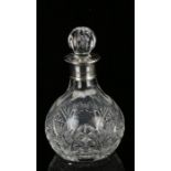 Elizabeth II silver rimmed decanter, the Birmingham silver rimmed with cut glass decanter with