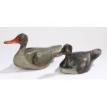 Two decoy ducks, the first with a red beak and grey body, 39cm long and the second in black and