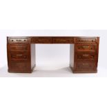 19th Century mahogany desk of unusual proportions, the long leather inset top having four short