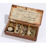 Collection of weights, the 19th Century oak box enclosing the collection of apothecary weights,