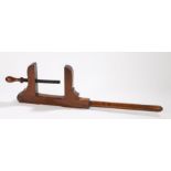 Early 19th Century walnut joiners clamp, of large size, with a screw thread cramp rod, 75cm long