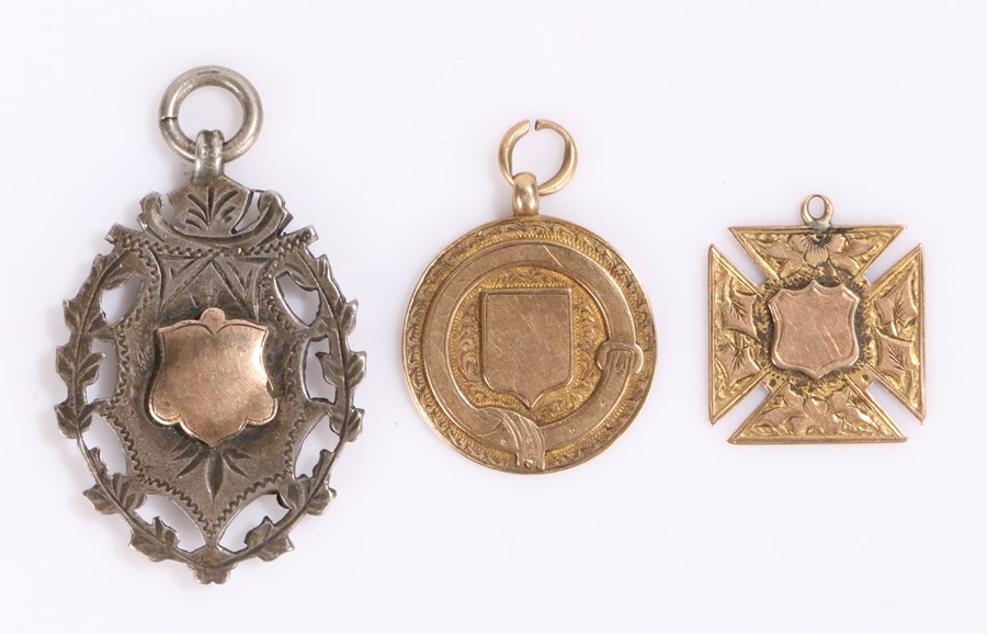 Two 9 carat gold medals, 4.8 grams and 3.5 grams, together with a silver medal, (3)
