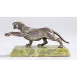 Art Deco paper weight, with a lioness reaching with a paw on a marble effect base, 15cm long