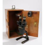 Charles Perry microscope, the black painted body with brass fittings, stamped "D.M.S 1295 M.O.F