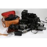 Cameras, binoculars and accessories, to include Car Zeiss Jenoptem 8x30w binoculars, Jhagee