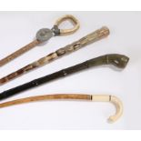 Walking sticks, to include an Indian horn example, a snake skin shooting stick, another horn example