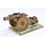 Early 20th Century desk weight brass model of a cannon, with a marble base, 20cm long