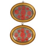 Pair of framed wax seals, the arraignments with figural and classical red seals housed in glazed