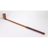 R J Gibson Calcutta Gassiat style putter, with half brass sole plate and burgundy leather grip, 87cm