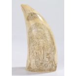 19th Century Scrimshaw whales tooth, with a crucifix scene to one side, the opposing side with