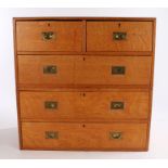 Victorian light oak campaign chest of two short and three long drawers, with recessed brass drawer