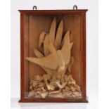 19th Century carving of a swallow, swooping down to the cluster of flowers and leaves, housed within