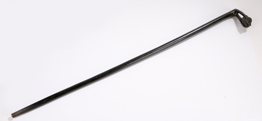 19th Century ebonised walking stick, the handle carved as a claw holding a moustached man's head, - Image 2 of 2