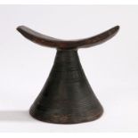 Ethiopian carved wooden head rest, on a tapering reeded base, 13cm high, 15.5cm wide