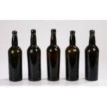 Five 19th Century brown glass bottles, with ring tops above the cylinder bodies, 30cm high, (5)