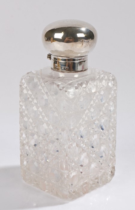 Victorian silver capped bottle, London 1896, the hinged lid with rubbed monogram above a cut glass