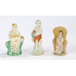 Three late 18th Century pearlware figures, to include a seated figure with a basket, another