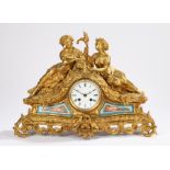 Late 19th Century French gilt metal mantel clock, Howell A Paris, with two reclining classical