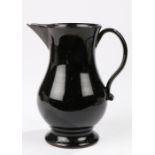 18th Century Jackfield pottery jug, circa 1755-60, the pointed spout with a baluster body and