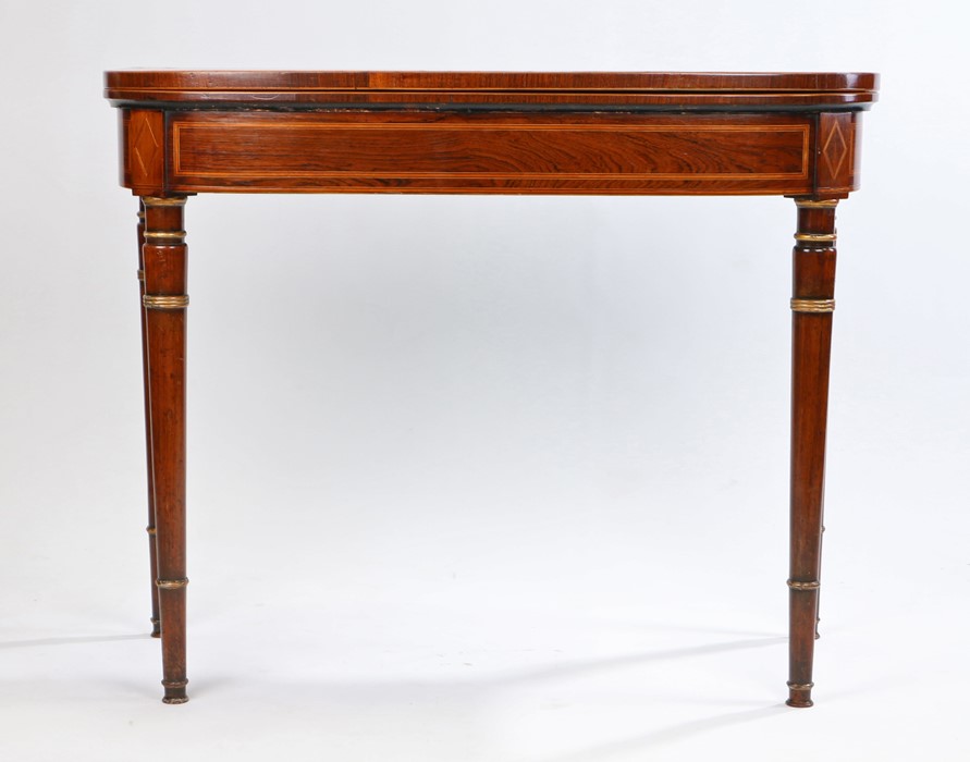 Regency rosewood card table, the hinged rectangular top with cross banding enclosing a baize top