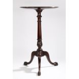 19th Century mahogany occasional table, the dish circular top above a turned column and carved