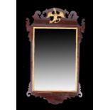 George III mahogany mirror, the rectangular mirror plate surmounted by a Hoho bird and an undulating
