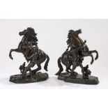 After Guillaume Coustou, (French 1677 - 1746), of small size, a pair of patinated bronze models of