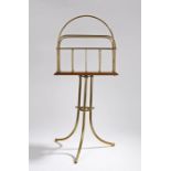 Victorian paper rack, with gilt brass arch gallery above an oak base and gilt brass arched legs,