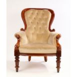 Victorian mahogany armchair, the arched top above a stuff over button back and seat flanked by