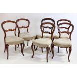 Set of six Regency rosewood balloon back dining chairs, with acanthus leaf carved tops above stuff