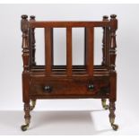 Victorian rosewood Canterbury, with four compartments above a single frieze drawer raised on