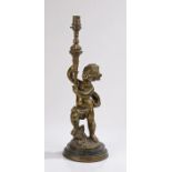 Gilt brass desk lamp, of a putto holding aloft a torch, raised on a marble base, 43cm high