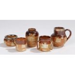 Miniature Doulton pottery, to include a tankard, a jug with a silver lip, a vase, a loving cup, a