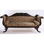 Regency mahogany settee, with acanthus leaf, scroll and urn carved back, foliate scroll carved arms,