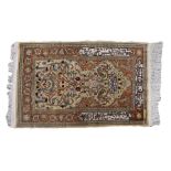 Turkish Kayseri prayer mat, with stylised foliate, scroll and script decorated central field and