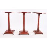 Three 20th Century red lacquered occasional table, the octagonal tops decorated with birds and
