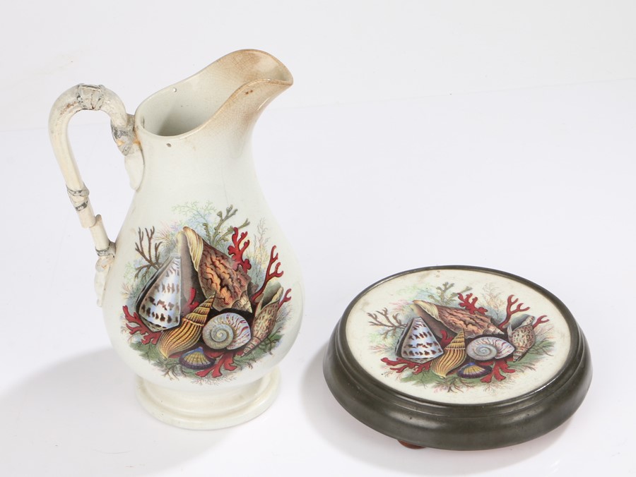 Victorian Pratt ware stand and jug, decorated with shells and corals, the stand with a pewter